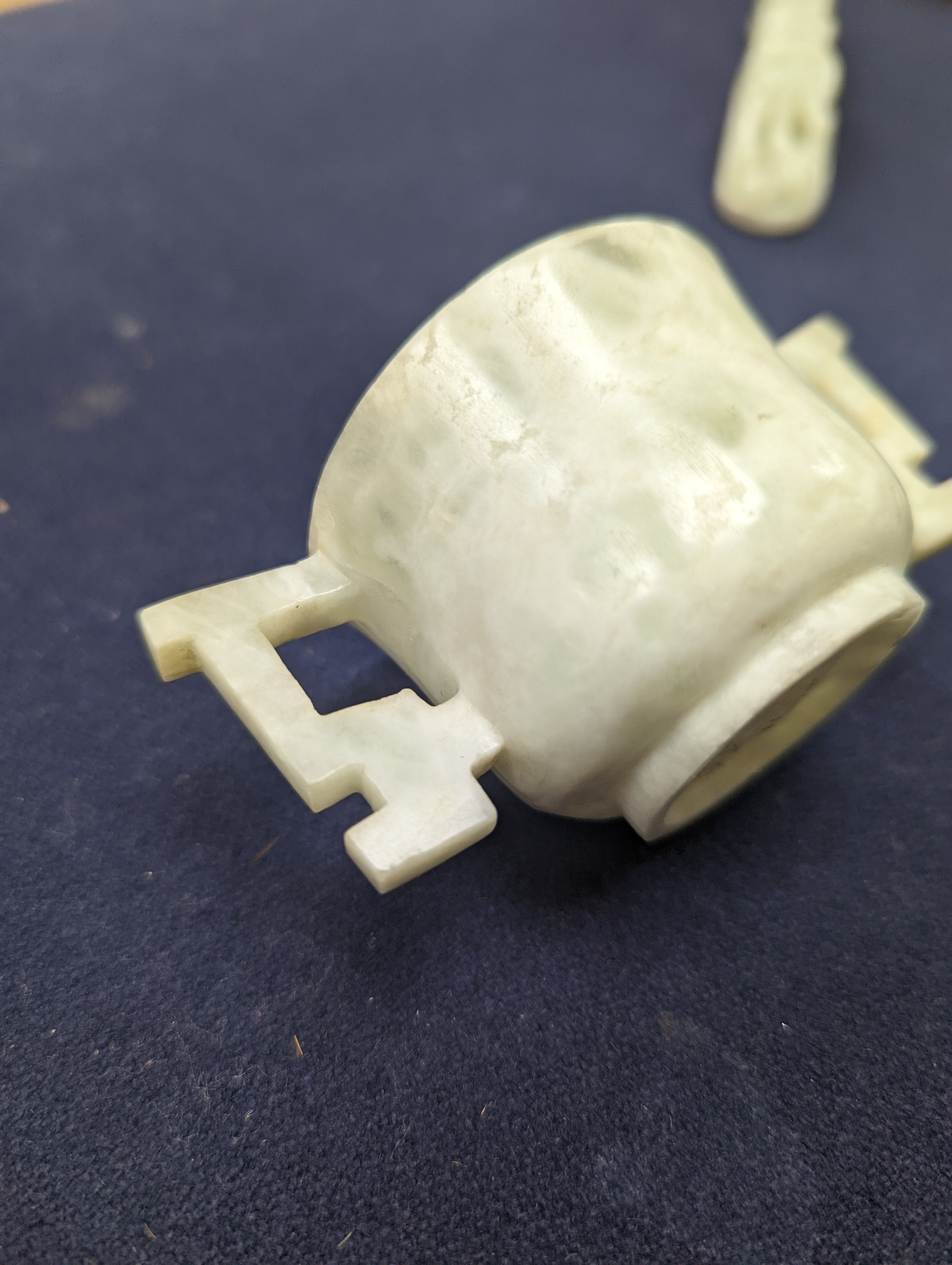 A Chinese jade belt hook, 12.5cm an archer's ring and figure, a stone cup and a glass snuff bottle